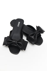 Black Leather Slides with a Bow