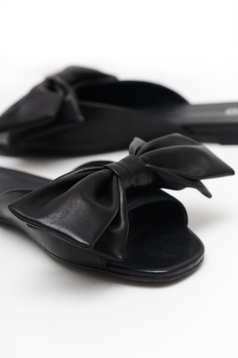 Black Leather Slides with a Bow